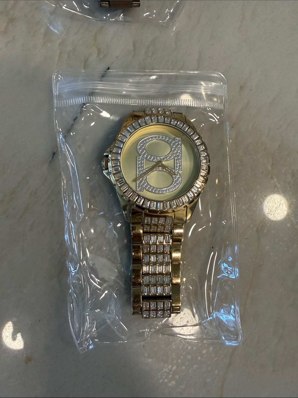 bebe Gold-Tone Crystal Logo Bracelet Watch